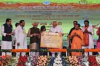  Prime Minister Narendra Modi gives a certificate of Prime Minister’s Housing Scheme during a public meeting, on September 23, 2017 in Varanasi. (Rajesh Kumar/Hindustan Times via Getty Images)