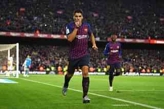  Luis Suarez celebrates scoring his hat-trick during the La Liga match between FC Barcelona and Real Madrid CF (David Ramos/Getty Images)