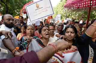 Members of Sabarimala Ayyappa Seva Samajam (SASS) take part in a protest against the Supreme Court verdict. (Biplov Bhuyan/Hindustan Times via Getty Images)