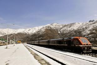 A train passes through snow covered railway track with the back drop of Snow Mountain after a heavy snowfall in Banihal some 110 km from Sringar. (Representative Image/Waseem Andrabi/Hindustan Times via Getty Images) 