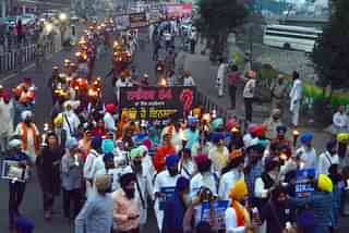 A procession demanding justice for victims of the 1984 riots. (Photo by Sameer Sehgal/Hindustan Times via Getty Images)