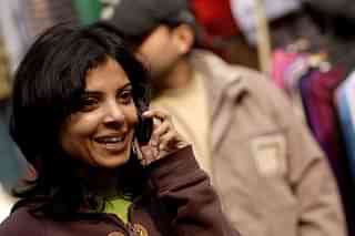 A woman talks on cell phone at Chandani Chowk market  in New Delhi, India. (Pradeep Gaur/Mint via Gettyimages) &nbsp;