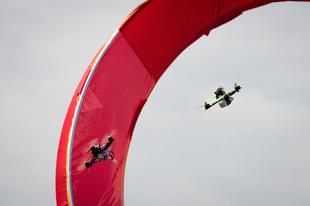 Drones fly through an obstacle course during practice day at the National Drone Racing Championships on Governors Island, August 5, 2016 in New York City.  (Photo by Drew Angerer/Getty Images)