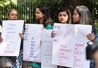 Women hold placards against sexual harassment in workspaces. (Mohd Zakir/Hindustan Times via Getty Images)