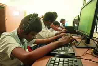 Students learn computer skills (Photo by Samir Jana/Hindustan Times via Getty Images)