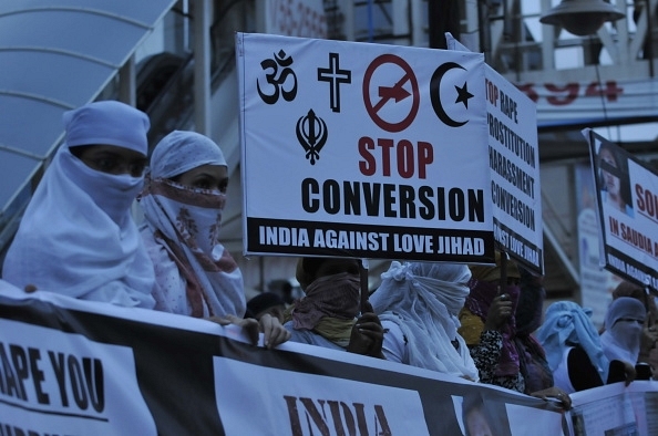  Women associated with India Against Love Jihad hold placards and form a human chain to protest against love jihad and conversion in Bhopal. (representative image) (Mujeeb Faruqui/Hindustan Times via Getty Images) 