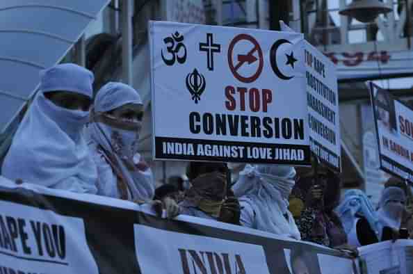  Women against love jihad hold placards to protest against the practice and conversion in Bhopal. (Mujeeb Faruqui/Hindustan Times via Getty Images)&nbsp;