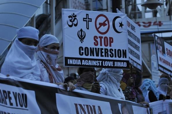  Women associated with India Against Love Jihad hold placards and form a human chain to protest against love jihad and conversion in Bhopal. (Mujeeb Faruqui/Hindustan Times via Getty Images)&nbsp;