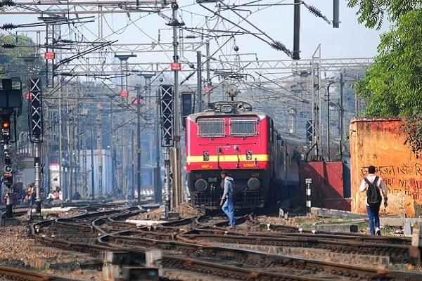 Man walking on railway tracks (Ramesh Pathania/Mint via Getty Images)