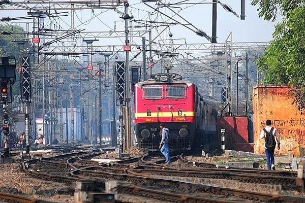 Man walking on railway tracks (Ramesh Pathania/Mint via Getty Images)