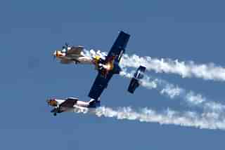 A team of Red Bull taking part in the Air Show as part of Aero India 2011 in Bengaluru. (Shekhar Yadav/India Today Group/Getty Images)