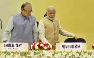 Prime Minister Narendra Modi along with Union Minister for Finance, Arun Jaitley, at the Delhi Economics Conclave 2015, on 6 November 2015 in New Delhi. (Sanjeev Verma/Hindustan Times via Getty Images)&nbsp;