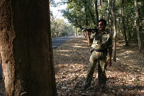 A commando of Crack60 guards the state highway that leads to Chhattisgarh (Photo by Satish Bate/Hindustan Times via Getty Images)