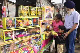 Children buy fireworks and crackers ahead of Diwali festival at a market in New Amritsar. (Sameer Sehgal/Hindustan Times via GettyImages)&nbsp;