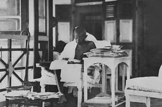 Mahatma Gandhi  reading his correspondance whilst living in seclusion after being released from prison. (Topical Press Agency/Getty Images)