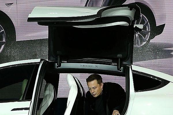 Tesla CEO Elon Musk steps out of the new Tesla Model X at an event (Justin Sullivan/Getty Images)
