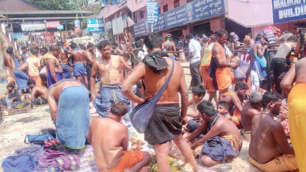 Pilgrims are forced to break coconuts to get the ghee poured inside it in open areas. Ghee is seen spilt in such places as pilgrims find it tough to get space. 