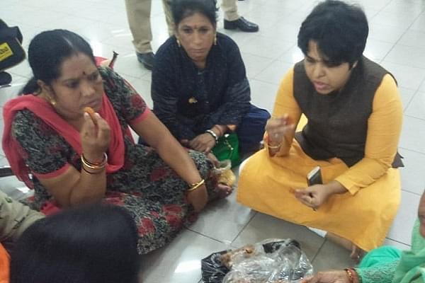Activist Trupti Desai sitting at Kochi airport (@ANI/Twitter)