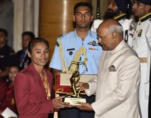 Athletics Hima Das receives Arjuna Award 2018 for her achievements in Athletics from President Ramnath Kovind during the National Sports and Adventure Award 2018 function, at Rashtrapati Bhawan. (Vipin Kumar/Hindustan Times via Getty Images)