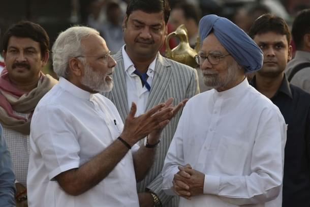 Prime Minister Narendra Modi with former prime minister Manmohan Singh in New Delhi. (Vipin Kumar/Hindustan Times via Getty Images) 