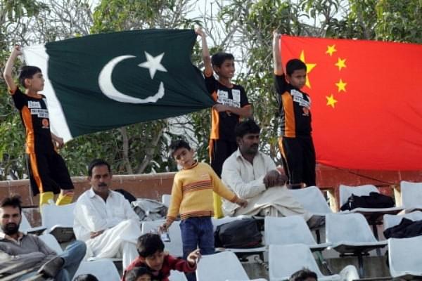Pakistani and Chinese flags (Photo by ASIF HASSAN/AFP/Getty Images)