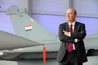 Dassault Aviation CEO Eric Trappier with a Rafale fighter jet in the background.&nbsp;