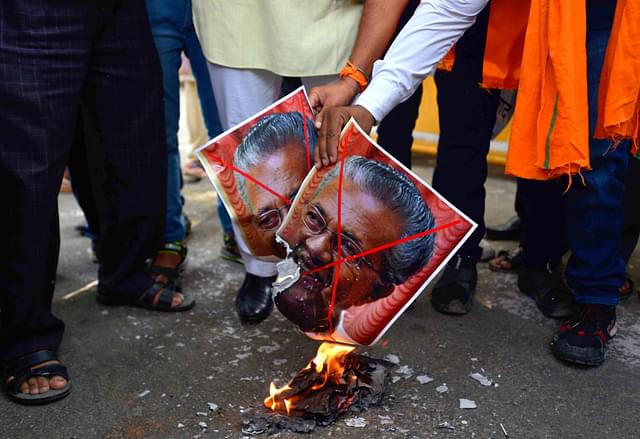 People protest against the Chief Minister of Kerala Pinarayi Vijayan against the state government for not filing the review petition. (Biplov Bhuyan/Hindustan Times via Getty Images)&nbsp;