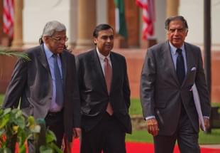 Mukesh Ambani (C) and Ratan Tata. (Photo by Daniel Berehulak/Getty Images)