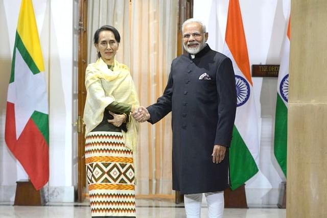 PM Narendra Modi shakes hands with Myanmar leader Aung San Suu Kyi before a meeting. (Pankaj Nangia/India Today Group/Getty Images)