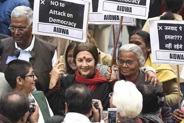 CPI leader Brinda Karat, D. Raja, JNU students, professors and CPI party members protest  at JNU Campus in 2016 (Photo by Sanjeev Verma/Hindustan Times via Getty Images)