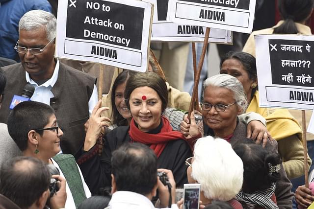 CPI leader Brinda Karat, D. Raja, JNU students, professors and CPI party members protest  at JNU Campus in 2016 (Photo by Sanjeev Verma/Hindustan Times via Getty Images)