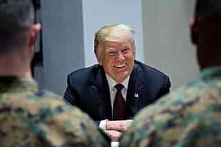 US President Trump smiles in a meeting with US marines in Washington, D.C. (Photo by Andrew Harrer-Pool/ Getty Images)