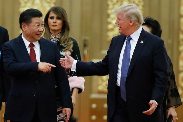 Chinese President Xi Jinping with US President Trump. (Thomas Peter - Pool/Getty Images)
