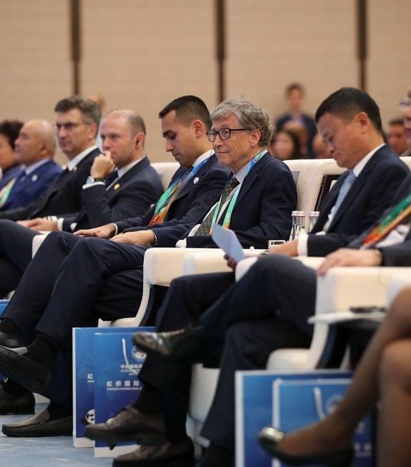 Delegates, including Bill Gates, at the expo. (Lintao Zhang/Getty Images)