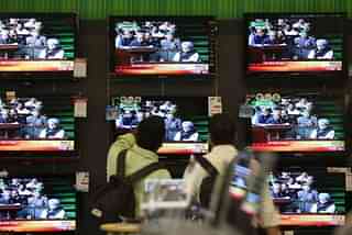 Annual Budget 2011-12 is seen on a TV Screen at the shop at Prabhadevi on Monday.(Kunal Patil/Hindustan Times via Getty Images)