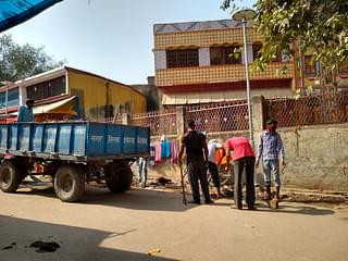 Nagar Nigam workers cleaning the debris from the roads.