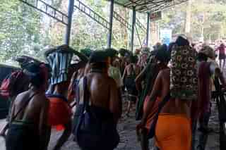 Pilgrims climb the Neelimala up on their way to the Sabarimala Ayyappa temple. Not a single toilet is available on the trek from the bottom of Neelimala to the top of it.
