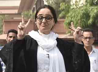 Lawyer Deepika Rajawat shows victory sign while talking to media at the Supreme Court lawn in New Delhi. (Sonu Mehta/Hindustan Times via Getty Images)&nbsp;