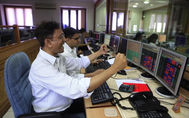 Traders rejoice as Sensex surges at Bombay Stock Exchange. (Anshuman Poyrekar/Hindustan Times via Getty Images)
