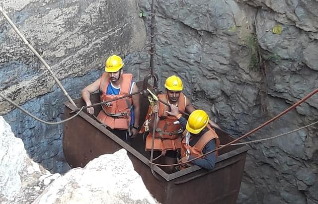 National Disaster Response Force (NDRF) team at the coal mine in Meghalaya’s East Jaintia Hills where 15 labourers are trapped. (image via ANI on Twitter)