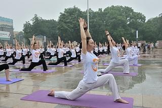 Chinese people celebrating International Yoga Day in 2015. (Photo by VCG/VCG via Getty Images)