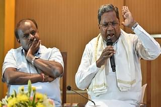 Karnataka CM  H D Kumarswamy with former CM Siddaramaiah at a press conference. (Arijit Sen/Hindustan Times via Getty Images)