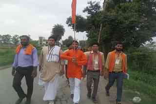 Prime accused Yogesh Raj in centre with flag. (Pic via Facebook)