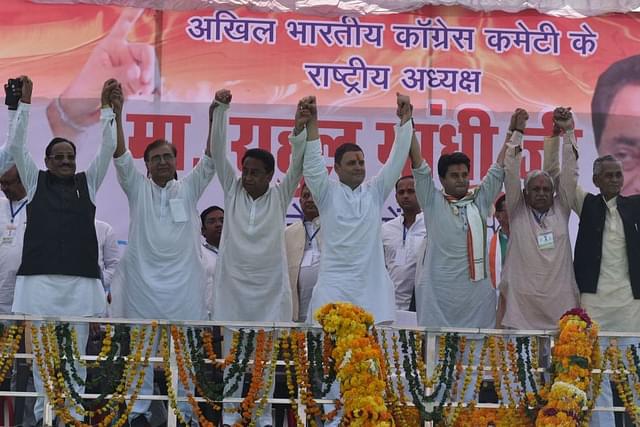 Congress president Rahul Gandhi joins hands with other party leaders during a public meeting in Madhya Pradesh.&nbsp; (Mujeeb Faruqui/Hindustan Times via Getty Images)&nbsp;