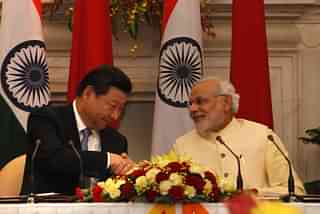Chinese President Xi Jinping with Indian PM Narendra Modi. (Arvind Yadav/Hindustan Times via Getty Images)