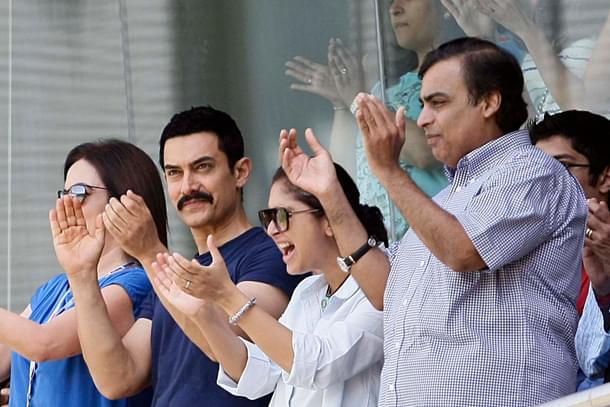 Amir Khan and Mukesh Ambani during the ICC Cricket World Cup 2011 Final match. (Naveen Jora/India Today Group/Getty Images)