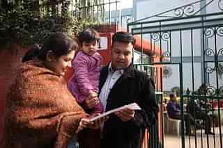 Parents reading Nursery Admission Form (Qamar Sibtain/India Today Group/Getty Images)