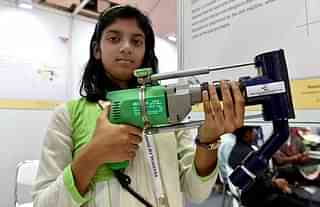 A student showcases a modified drill for collecting dust at the Festival of Innovation and Entrepreneurship in New Delhi. (Mohd Zakir/Hindustan Times via Getty Images)&nbsp;