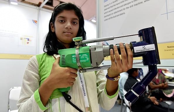 A student showcases a modified drill for collecting dust at the Festival of Innovation and Entrepreneurship in New Delhi. (Mohd Zakir/Hindustan Times via Getty Images)&nbsp;