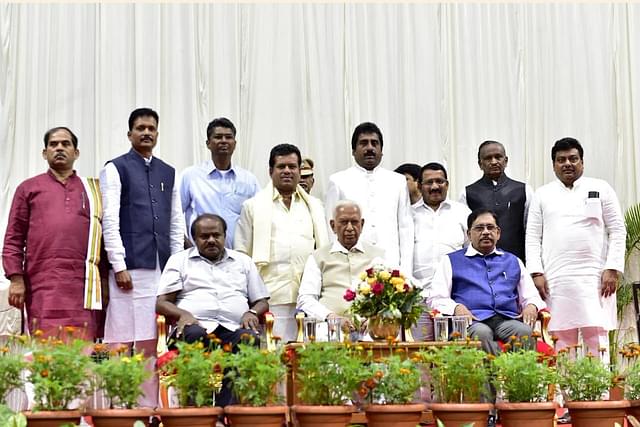 Newly inducted ministers in the Karnataka cabinet pose for photographs with CM HD Kumaraswamy and the Governor of Karnataka. (Photo Via Twitter/CMofKarnataka)